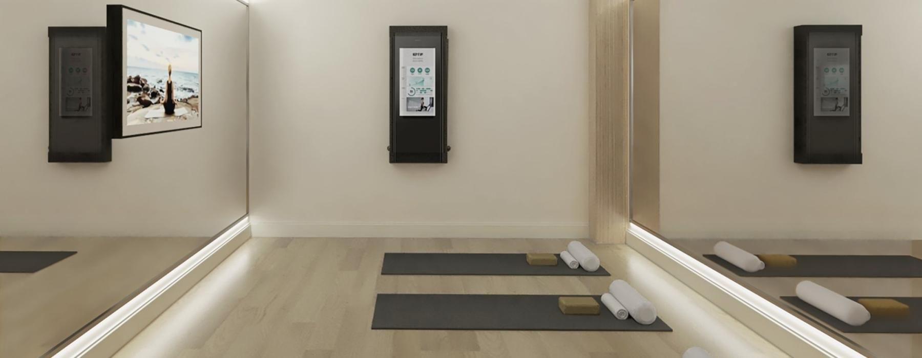 an exercise room with floor mats and mirrors